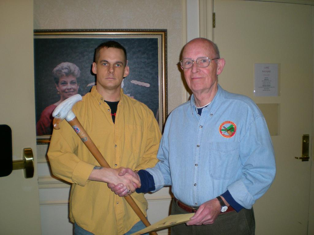 Army CPT Christopher Wiley (left), presented by RET Col. Dick Sniffen. Cane carved by John Page, MVA&WA.