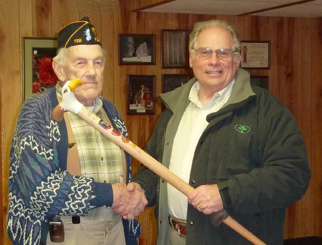 Navy Electrician Mate 3rd Class Delbert M. Nash. Cane carved by Frank Bottego of HVWC.Presented by Pat Paraggio, (right), of HVWC.