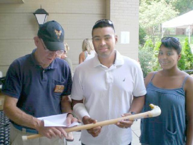 Army Sgt Erick Santamaria. Cane carved by Frank Bottego of HVWC. Presented by COL Sniffen (Left).