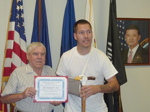 Army Sgt George H Eck. Cane carved by Eric Sund of HVWC. Left to Right: Eric Sund, Sgt George H Eck. Presented at Castle Point VA Health Facility.