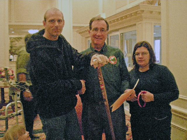 Presentation to Army SPC George Wilmot with Col Connors and Wife. Cane carved by John Helmeyer of HVWC.