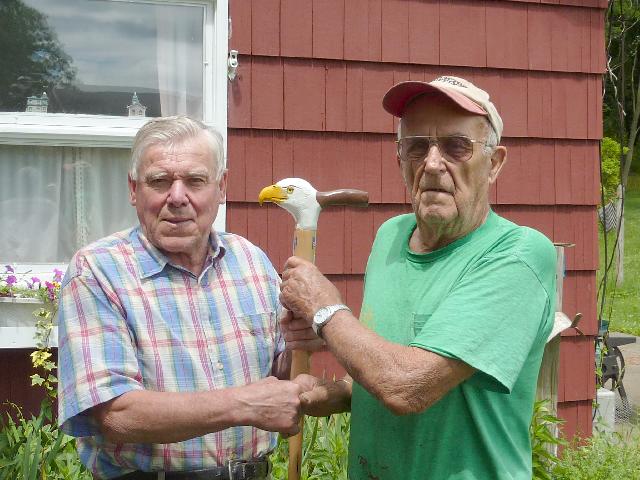 Army T-Sgt Kenneth H Mallen, (Right). Cane carved by Eric Sund of HVWC. Presented by Eric Sund of HVWC.