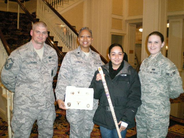 Cane presented by USAF MSgt Stohkman, LCol Jones, A2c Moreno to Army SPC Victoria Montenegro. Cane carved by Clay Brooks of HVWC.