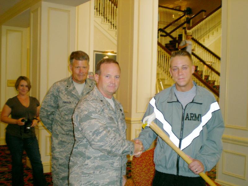 Army SGT Colin Dudziak presented by Brigadier General Haught. Cane carved by Eric Sund of HVWC.