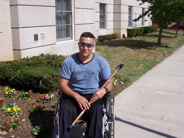 Army SGT Hassan Han. Cane carved by Hal Weisel of HVWC.