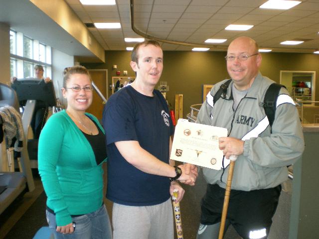 Army SSG Michael Brown. Presented by SFC Dale Cherney. Cane carved by Dick Moran of of MVA&WA.