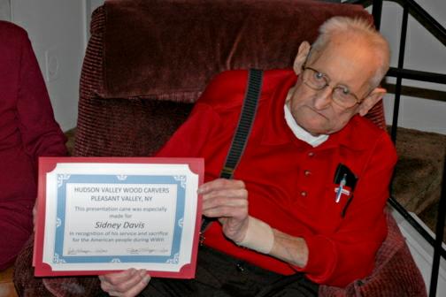 Army PFC Sidney Davis, WWII Veteran, holding Cane information at his home, 21 Nov. 2009